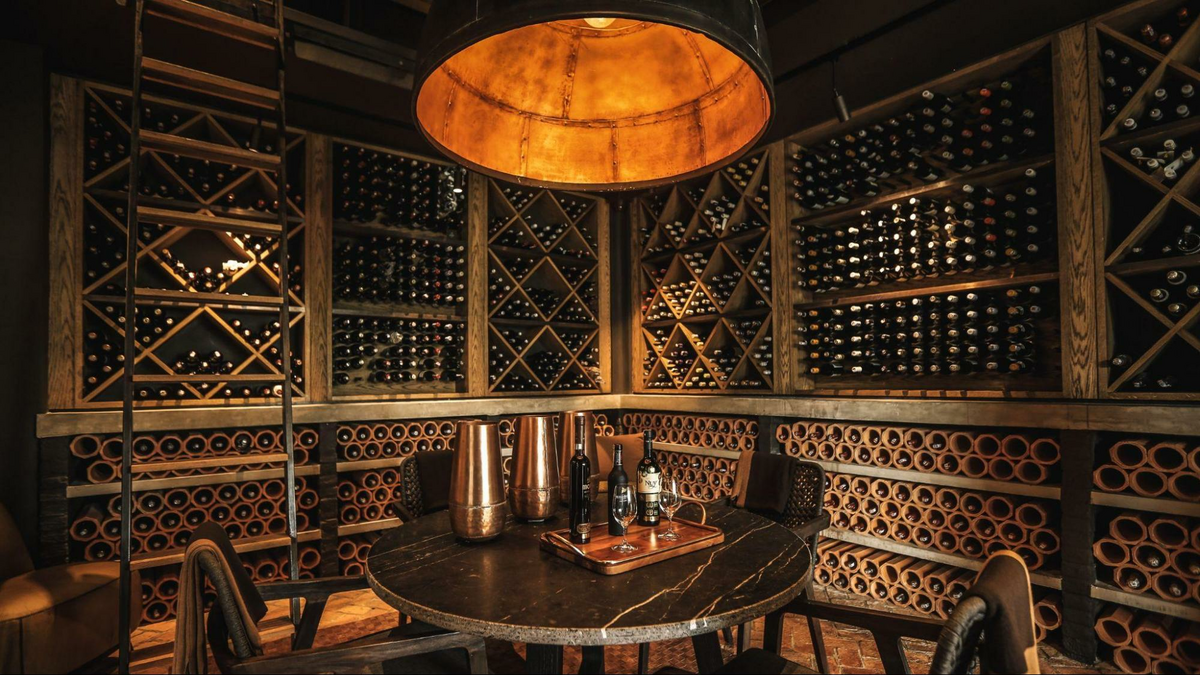 an elaborate, beautiful wine cellar, as shown in The Wine Mover’s blog post on wine moving services and wine shipping